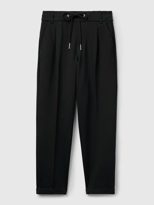 Pantaloni tinta unita con coulisse Pantaloni tinta unita con coulisse Donna