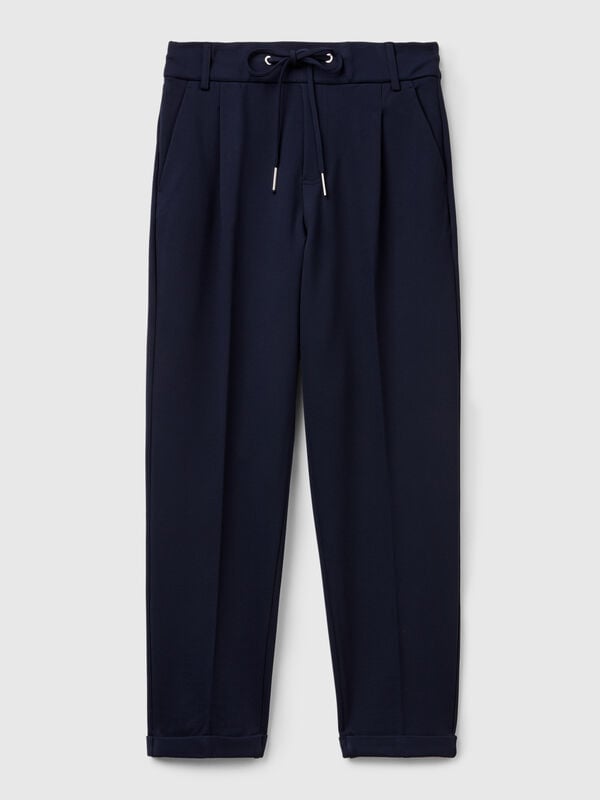 Pantaloni tinta unita con coulisse Pantaloni tinta unita con coulisse Donna