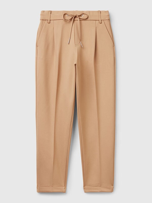 Pantaloni tinta unita con coulisse Pantaloni tinta unita con coulisse Donna