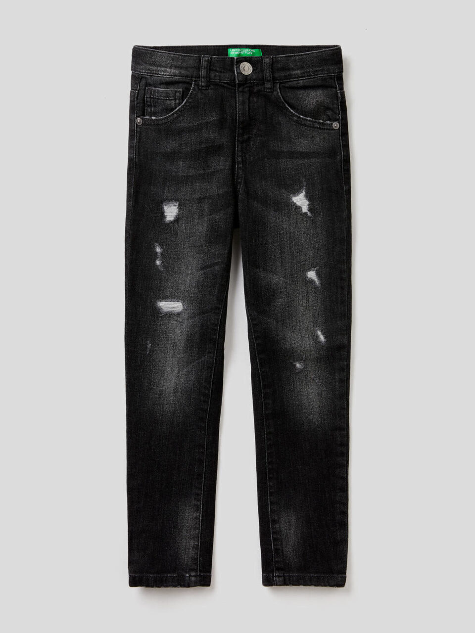 Jeans skinny fit con rotture image number 1