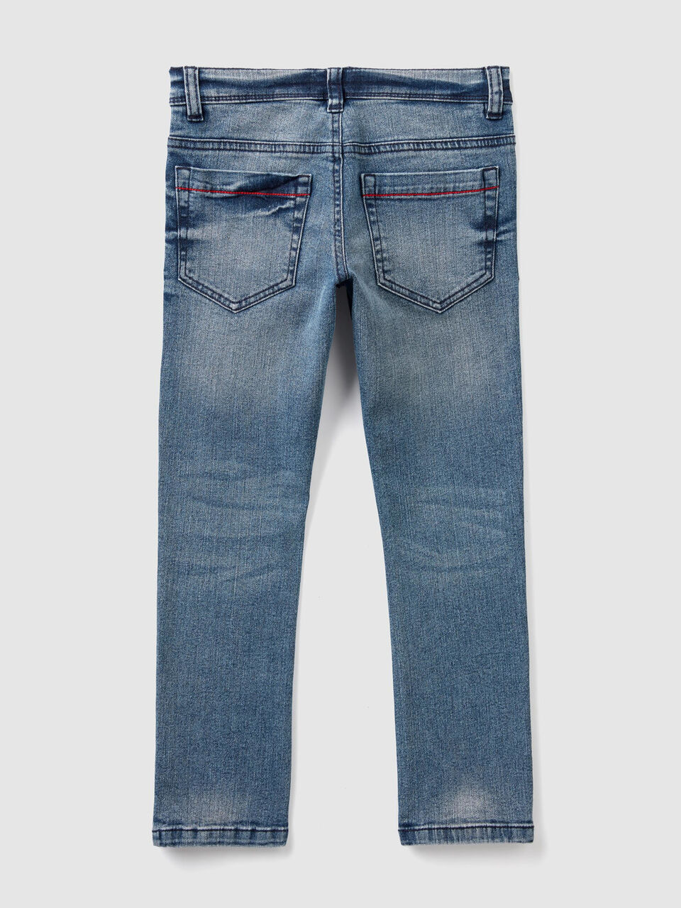 Jeans slim fit con toppe colorate image number 2