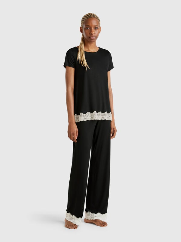 Pantaloni fluidi con dettagli in pizzo Donna